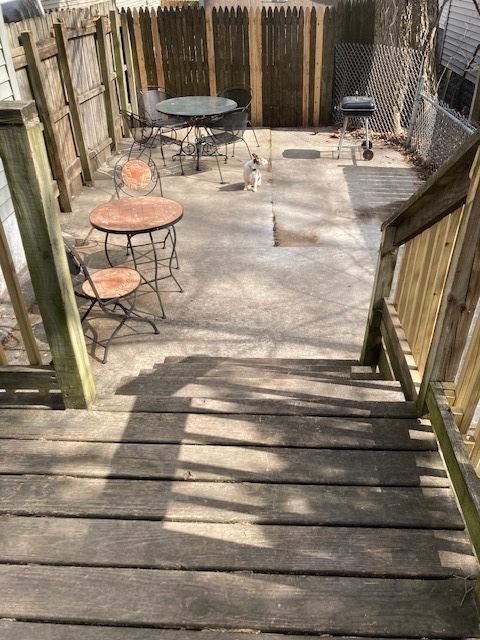 wooden deck with fence and outdoor dining space