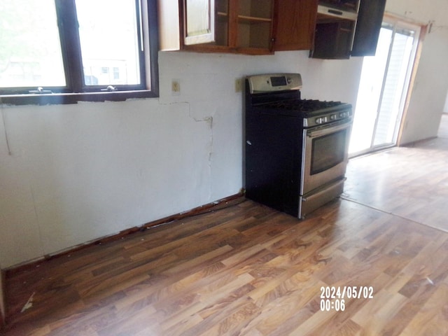 kitchen featuring gas range and wood finished floors