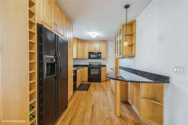 5116 N New England Ave, Chicago, IL 60656 - kitchen featuring open shelves, black appliances, light wood-style floors, and light brown cabinets