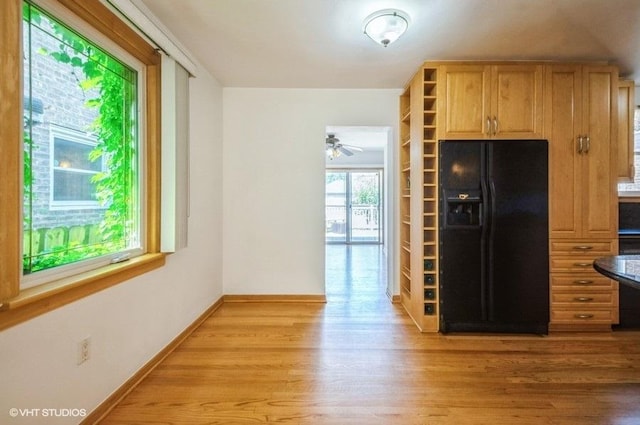 5116 N New England Ave, Chicago, IL 60656 - kitchen with black fridge with ice dispenser, light wood-style floors, and open shelves