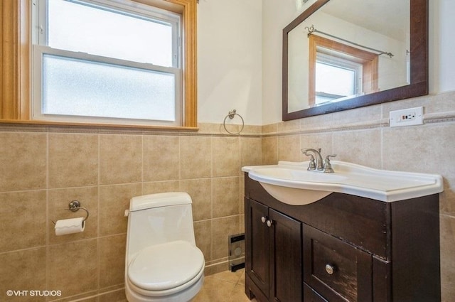 5116 N New England Ave, Chicago, IL 60656 - bathroom with vanity, tile walls, and wainscoting