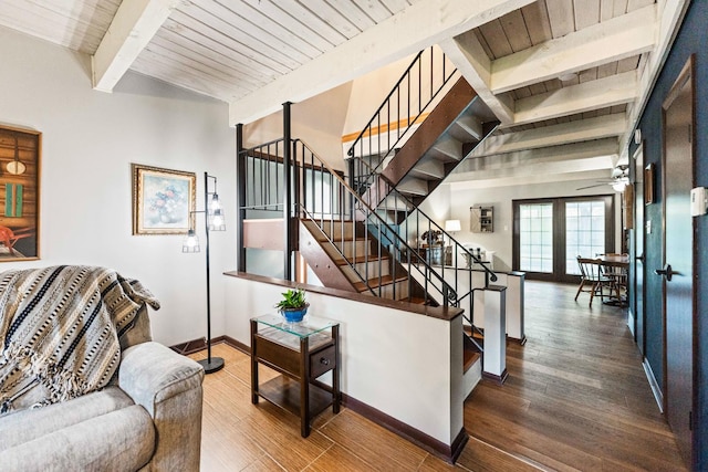 stairs with a ceiling fan, baseboards, wood ceiling, wood finished floors, and beam ceiling