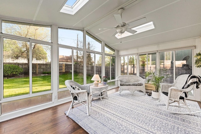sunroom featuring a wealth of natural light, ceiling fan, and a skylight