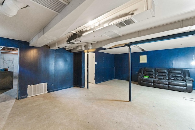 finished basement featuring visible vents