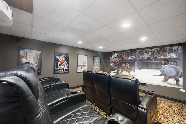 2401 Legacy Dr, Aurora, IL 60502 - cinema room featuring a paneled ceiling, a wall mounted air conditioner, carpet, baseboards, and recessed lighting