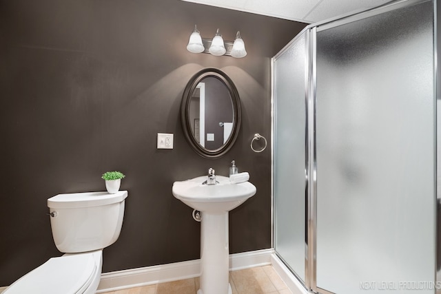 2401 Legacy Dr, Aurora, IL 60502 - full bathroom with a stall shower, toilet, tile patterned floors, and baseboards