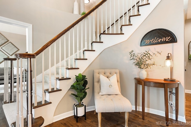 2401 Legacy Dr, Aurora, IL 60502 - stairway with wood finished floors, baseboards, and a towering ceiling