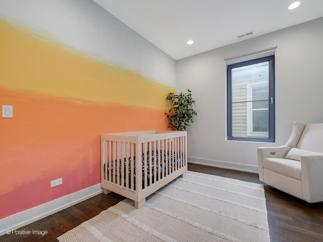 bedroom featuring baseboards, recessed lighting, visible vents, and wood finished floors