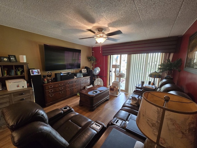 living room featuring ceiling fan and wood finished floors