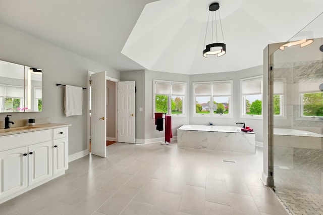bathroom with a garden tub, vanity, a shower, baseboards, and lofted ceiling