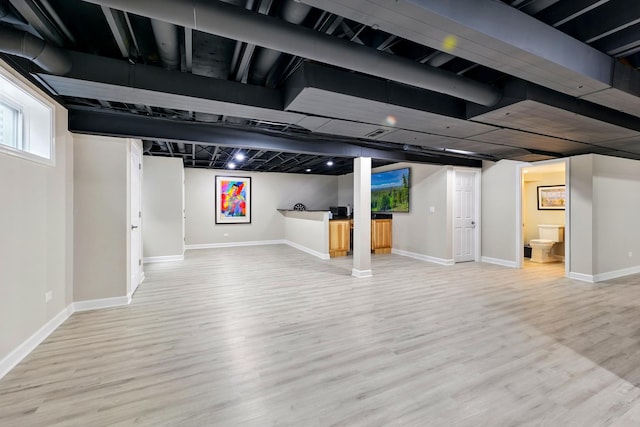 below grade area with wood finished floors and baseboards