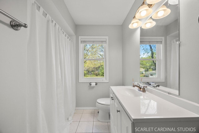 full bathroom with tile patterned flooring, vanity, toilet, and baseboards