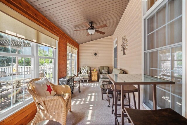 1721 Partridge Pt, Normal, IL 61761 - sunroom / solarium featuring lofted ceiling, outdoor dining space, a ceiling fan, wooden walls, and wooden ceiling