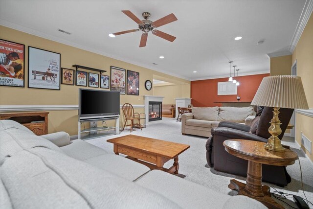 1721 Partridge Pt, Normal, IL 61761 - carpeted living area featuring a glass covered fireplace, ornamental molding, recessed lighting, a ceiling fan, and baseboards