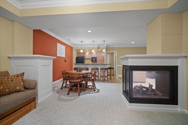 1721 Partridge Pt, Normal, IL 61761 - dining space with a multi sided fireplace, carpet flooring, baseboards, ornamental molding, and recessed lighting