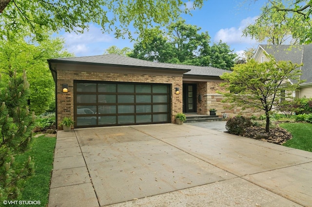 419 N Lincoln Ln, Arlington Heights, IL 60004 - view of front of property with brick siding, driveway, an attached garage, and roof with shingles