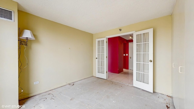 111 W Maple St Unit 1001, Chicago, IL 60610 - unfurnished room featuring french doors, baseboards, and a heating unit