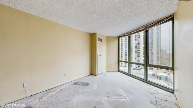 111 W Maple St Unit 1001, Chicago, IL 60610 - unfurnished room featuring a textured ceiling