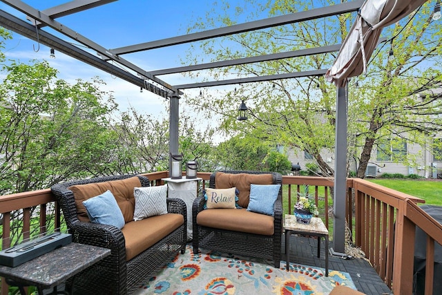 wooden terrace featuring a pergola and an outdoor living space