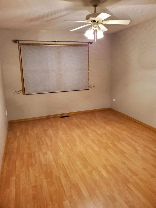 5849 Emerson St, Morton Grove, IL 60053 - empty room with baseboards, light wood finished floors, ceiling fan, and visible vents