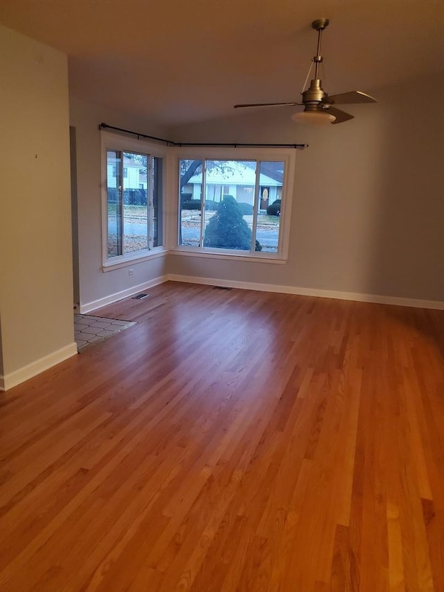 5849 Emerson St, Morton Grove, IL 60053 - unfurnished room featuring wood finished floors, baseboards, and ceiling fan