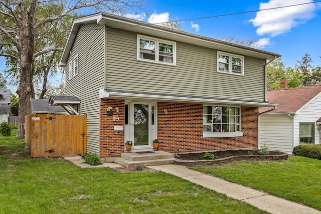 19 S 11th St, Saint Charles, IL 60174 - view of front of property with brick siding and a front yard