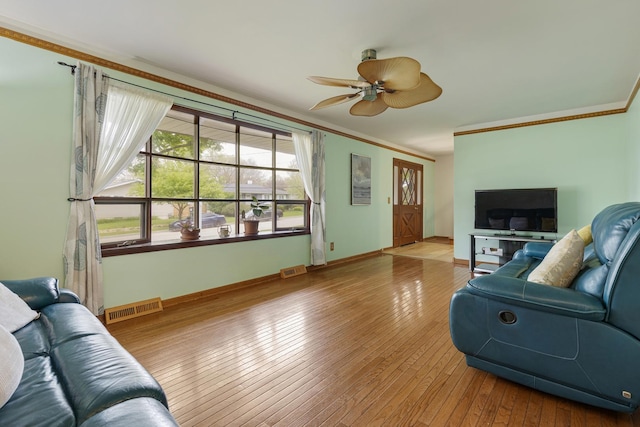 19 S 11th St, Saint Charles, IL 60174 - living area featuring ornamental molding, a ceiling fan, hardwood / wood-style flooring, and baseboards