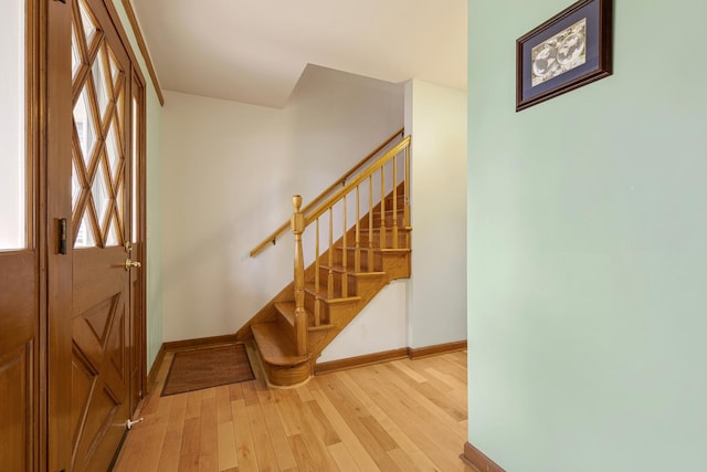 19 S 11th St, Saint Charles, IL 60174 - entrance foyer featuring baseboards, light wood-type flooring, and stairway