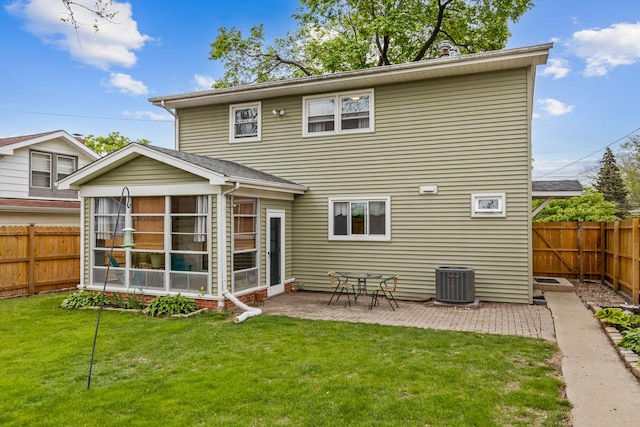 19 S 11th St, Saint Charles, IL 60174 - back of property with a sunroom, central AC, and a patio