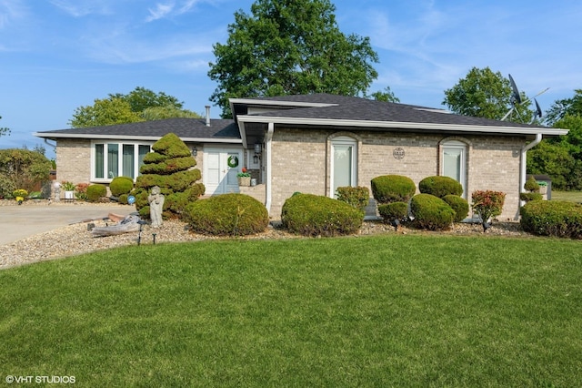 3513 Lyle Ln, Crete, IL 60417 - view of front of home with roof with shingles, brick siding, and a front lawn