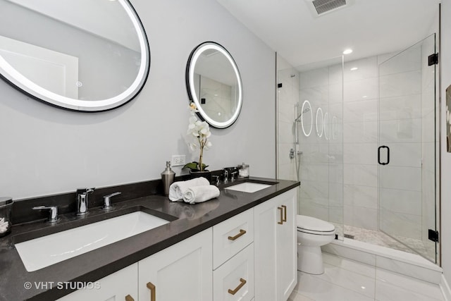 847 W Ainslie St Unit 2E, Chicago, IL 60640 - bathroom with a sink, toilet, a shower stall, and visible vents
