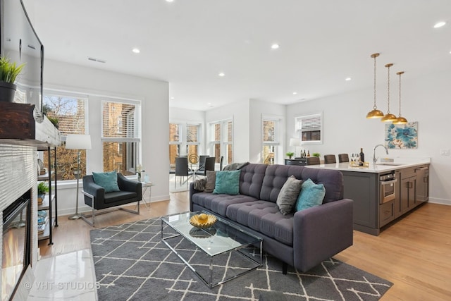 847 W Ainslie St Unit 2E, Chicago, IL 60640 - living room featuring recessed lighting, light wood-style floors, a healthy amount of sunlight, and visible vents