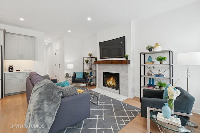 847 W Ainslie St Unit 2E, Chicago, IL 60640 - living area with recessed lighting, wood finished floors, baseboards, and a tile fireplace