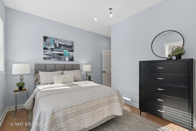 847 W Ainslie St Unit 2E, Chicago, IL 60640 - bedroom featuring wood finished floors and baseboards