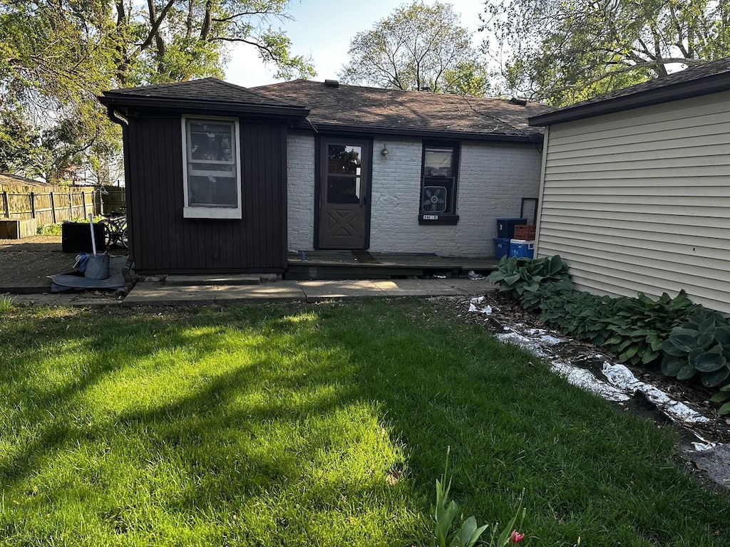 707 E Olympian Rd, Urbana, IL 61802 - back of house with a yard and fence