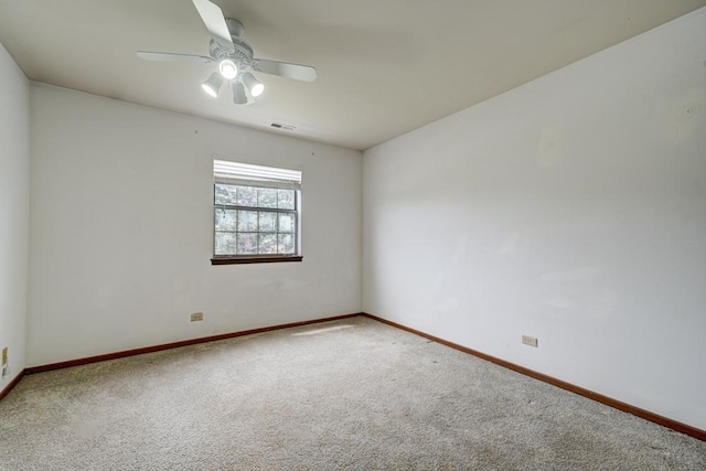unfurnished room featuring baseboards, ceiling fan, carpet flooring, and visible vents