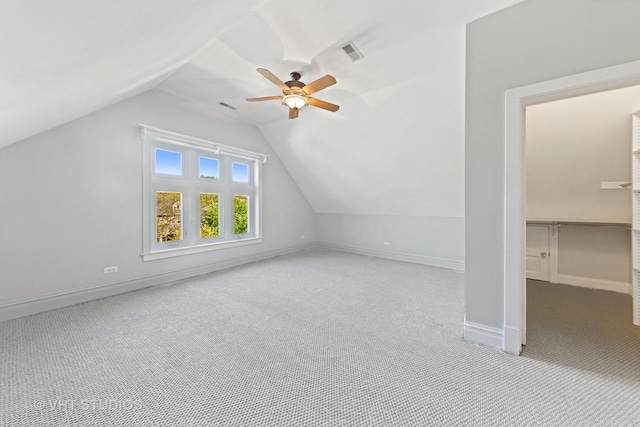 bonus room with carpet, ceiling fan, vaulted ceiling, and baseboards