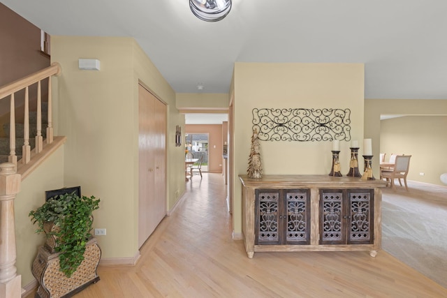 2013 Graystone Dr, Joliet, IL 60431 - corridor with stairs, wood finished floors, and baseboards