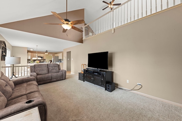 2013 Graystone Dr, Joliet, IL 60431 - living room featuring ceiling fan, carpet floors, baseboards, and a high ceiling