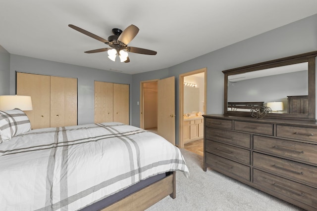 2013 Graystone Dr, Joliet, IL 60431 - bedroom featuring multiple closets, light colored carpet, ensuite bath, and ceiling fan