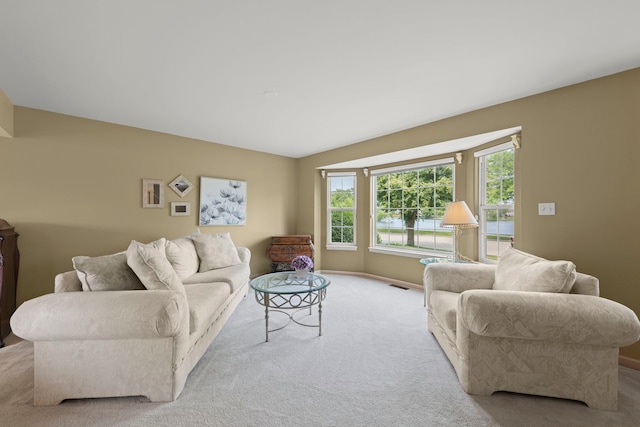 2013 Graystone Dr, Joliet, IL 60431 - carpeted living room with lofted ceiling and baseboards