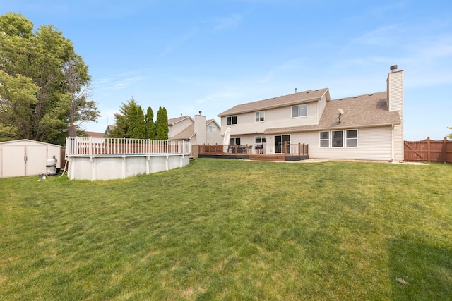 2013 Graystone Dr, Joliet, IL 60431 - back of property with a deck and a chimney