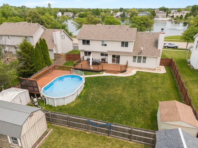 2013 Graystone Dr, Joliet, IL 60431 - view of swimming pool with a deck with water view, a residential view, and an outdoor structure