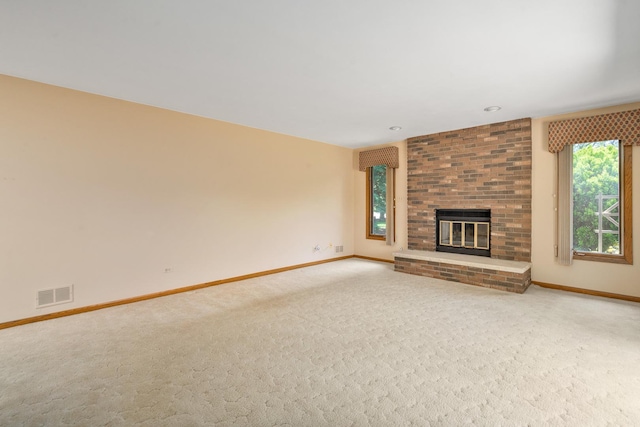 9228 Ridgeland Ave, Oak Lawn, IL 60453 - unfurnished living room featuring carpet floors and a brick fireplace