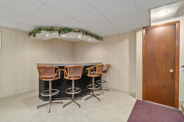 9228 Ridgeland Ave, Oak Lawn, IL 60453 - indoor dry bar with a drop ceiling, tile patterned floors, and wooden walls