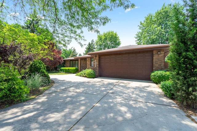 9228 Ridgeland Ave, Oak Lawn, IL 60453 - view of front of property with brick siding, driveway, and an attached garage