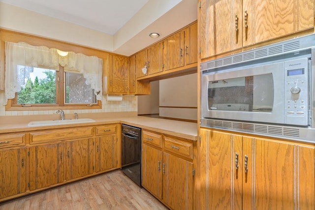 9228 Ridgeland Ave, Oak Lawn, IL 60453 - kitchen featuring stainless steel microwave, dishwasher, light countertops, brown cabinets, and backsplash