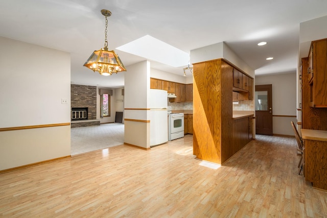 9228 Ridgeland Ave, Oak Lawn, IL 60453 - kitchen with white appliances, brown cabinets, light wood-style floors, a chandelier, and recessed lighting