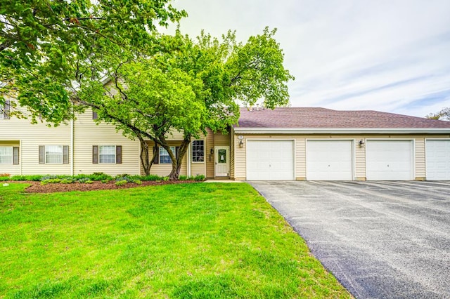99 Gant Cir Unit C, Streamwood, IL 60107 - view of front of house with aphalt driveway and a front yard