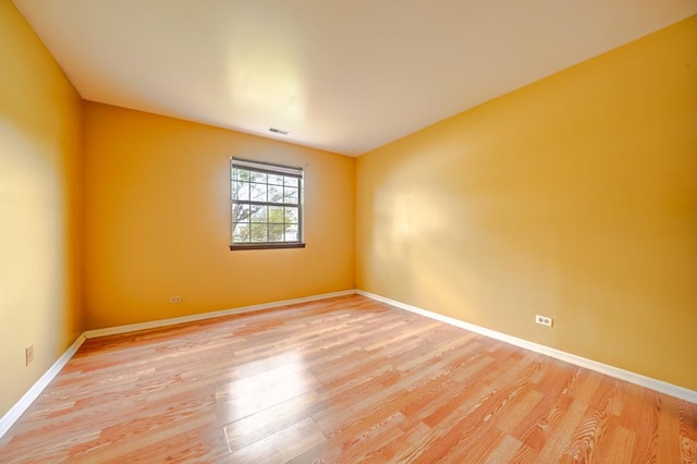 99 Gant Cir Unit C, Streamwood, IL 60107 - unfurnished room featuring baseboards, light wood-style flooring, and visible vents